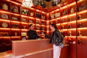 a man and a woman standing at a counter at Almaha Marrakech Restaurant & SPA in Marrakesh +68 photos