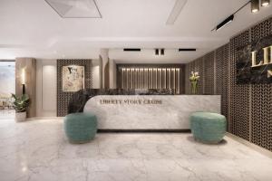 a lobby with a waiting area with two blue stools at Five-Stars Deluxe River Kruz from Aswan to Luxor 3 Nights in Aswān