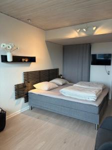 Tempat tidur dalam kamar di Bakkehegnet 2