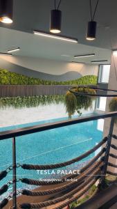 a view of a swimming pool in a building at Fantasia apartmani - Tesla palace in Kragujevac