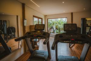 a gym with two exercise bikes in a room at Yemanjá Hotel by Preabeach Experience in Prea