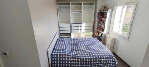 a small bedroom with a bed in a room at Villa piscine et jacuzzi la madonnette in Spéracèdes +25 photos