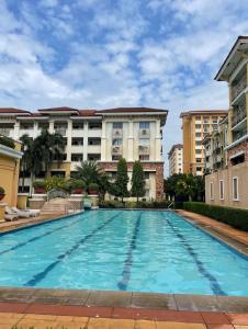 a large swimming pool in front of a building at Secret Nest in Manila