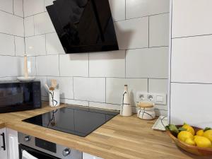 a kitchen with a counter with a bowl of fruit at Las eras 84 in Níjar