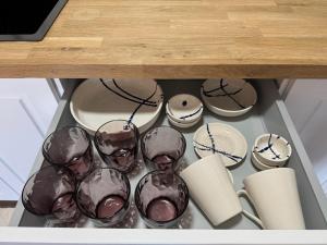a group of wine glasses sitting in a drawer at Las eras 84 in Níjar