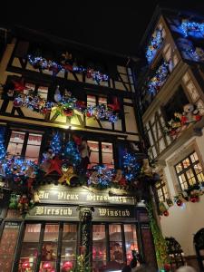 a building decorated with christmas lights and christmas decorations at Appartement rez de chaussée - 2 chambres in Bischheim +13 photos