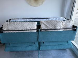 a bunk bed with two pillows on it at sunset lodge calais in Calais +2 photos