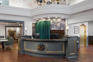 a lobby of a hotel with a reception desk at Cartwright Hotel Union Square - BW Premier Collection in San Francisco