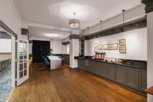 a lobby with a counter and a table in a room at Cartwright Hotel Union Square - BW Premier Collection in San Francisco