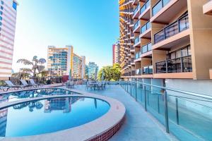 a swimming pool in the middle of a building at Kubitschek Plaza Hotel - Flat Particular ALM in Brasília