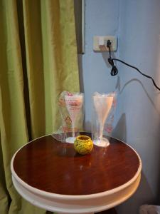a wooden table with some food on top of it at Budget Place Homestay-Solo Traveler in Ban Dan +11 photos