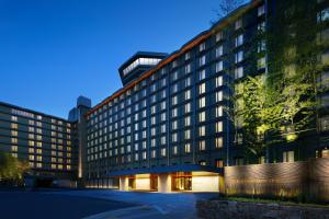 a large building with a clock on the side of it at RIHGA Royal Hotel Kyoto in Kyoto