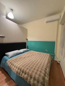 a bedroom with a bed in a room at B&B MaKri in Boltiere