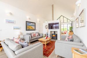 a living room with two couches and a fireplace at 3 Bed in Bamburgh oc-w31886 in Bamburgh