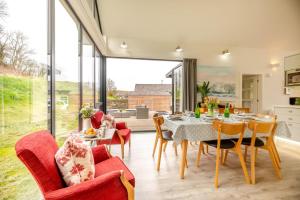 a dining room with a table and chairs at 3 Bed in Bamburgh oc-w31886 in Bamburgh
