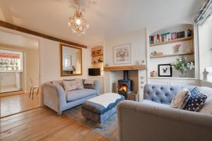 a living room with a couch and a fireplace at 2 Bed in Holt oc-2195 in Holt