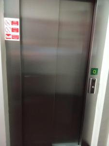 a metal elevator in a subway train at Hs Nieves Centro in Chipiona +16 photos