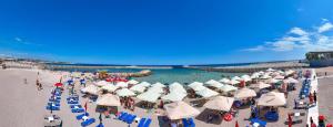 an overhead view of a beach with chairs and umbrellas at Office Villas Costinesti in Costinesti +35 photos