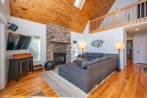 a living room with a couch and a fireplace at AAH Chalet by Railey Vacations in Oakland