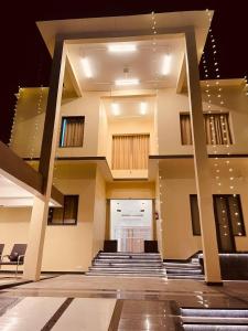 a view of a building with stairs and a lobby at Shree Shivay Homestay in Sathri
