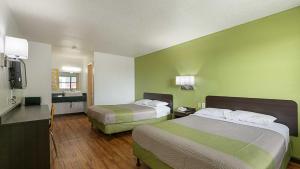 a hotel room with two beds and a kitchen at Motel 6 Chattanooga, TN in Silverdale +30 photos