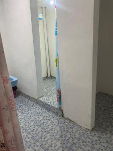 a hallway of a bathroom with a toilet in it at Casa Ecológica Angangueo in Mineral de Angangueo