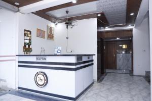 a lobby with a counter in a building at New Awadhesh Singh Hotel in Chauri