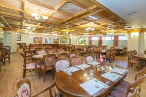 a large dining room with tables and chairs at Hotel & Museum Dona Gracia in Tiberias