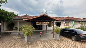 a car parked in front of a building at Hotel Miracema Palace LTDA in Miracema do Norte +16 photos