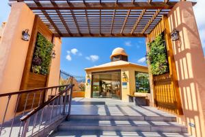 an entrance to a building with a stairway at Tagoro Family & Fun Costa Adeje in Adeje