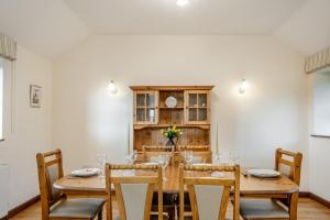 a dining room with a wooden table and chairs at 3 Bed in Whitwell oc-h33498 in Whitwell
