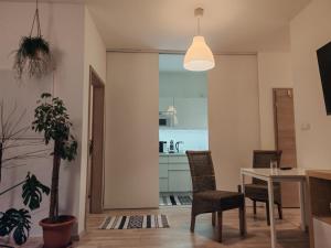 a dining room with a table and chairs at Boho style apartment with garage and large terrace in Bratislava