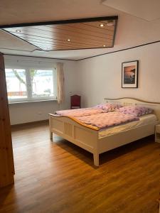 a bedroom with a large bed in a room at Zum Talblick in Limbach