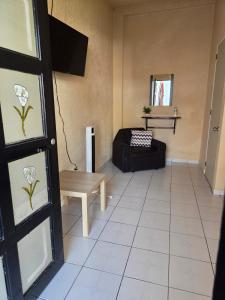 a living room with a couch and a table at Hotel Casa del virrey Atlixco in Atlixco