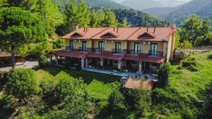an aerial view of a house on a hill at Aphrodite's Inn Kalavrita in Kalavrita