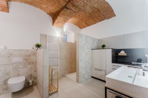 a bathroom with a toilet and a sink at Gut Pecketsberg in Oepping +31 photos