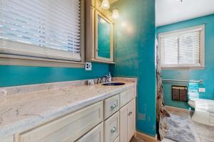 a bathroom with a sink and a toilet at Live Laugh Lake - A in Rushville +18 photos