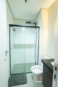 a bathroom with a shower and a toilet at Studio Prime Cuiaba 1709 in Cuiabá
