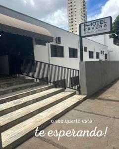 a building with a sign for a hotel zaza at Hotel Ravena Araraquara in Araraquara