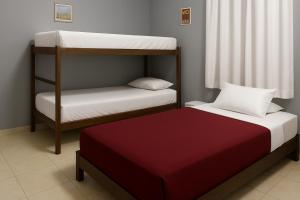 a room with two bunk beds and a bed at Quarto - Room Econômico da Maricotinha - No Air Cond in Manaus
