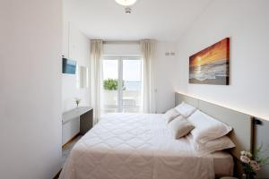 Postel nebo postele na pokoji v ubytování Hotel Capri + 107 fotografií