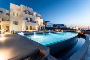 a swimming pool in front of a building at Agnadi Hotel in Agia Anna Naxos