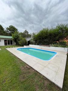 a swimming pool in the backyard of a house at Casa Marina in Monte Hermoso