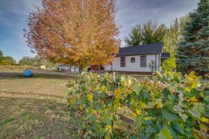a house with a tree in the yard at Brewster's Farm in Florence