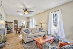 a living room with a couch and a ceiling fan at Brewster's Farm in Florence