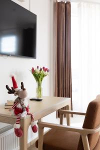 a toy rabbit sitting on a table in a room at Polar Nook Hotel in Rovaniemi