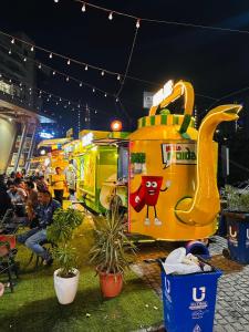 a group of food trucks lined up at an event at Aawas studio in Noida