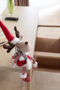a stuffed animal is sitting on a table at Polar Nook Hotel in Rovaniemi +16 photos