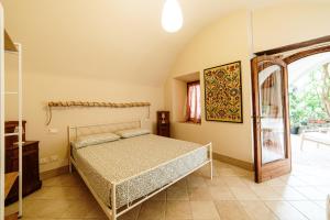 a bedroom with a bed and a large window at La Dimora in Roe