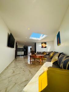 a living room with a couch and a table at بوابة الشمس 2 in Agadir +17 photos